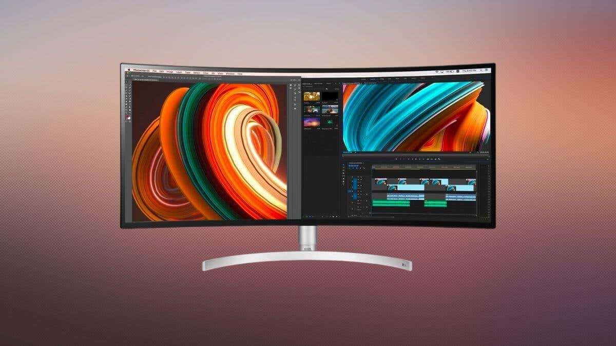 A curved monitor displays vibrant abstract artwork and video editing software